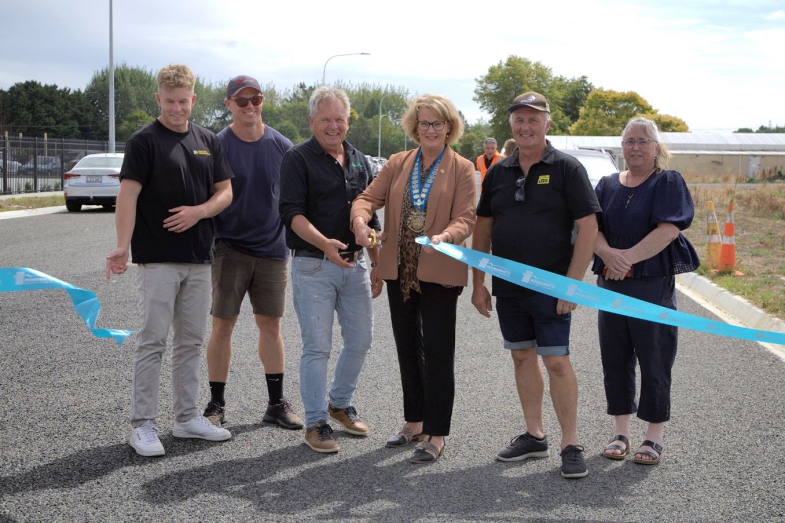 Cutting the official ribbon opening stage one of Turners Road extension